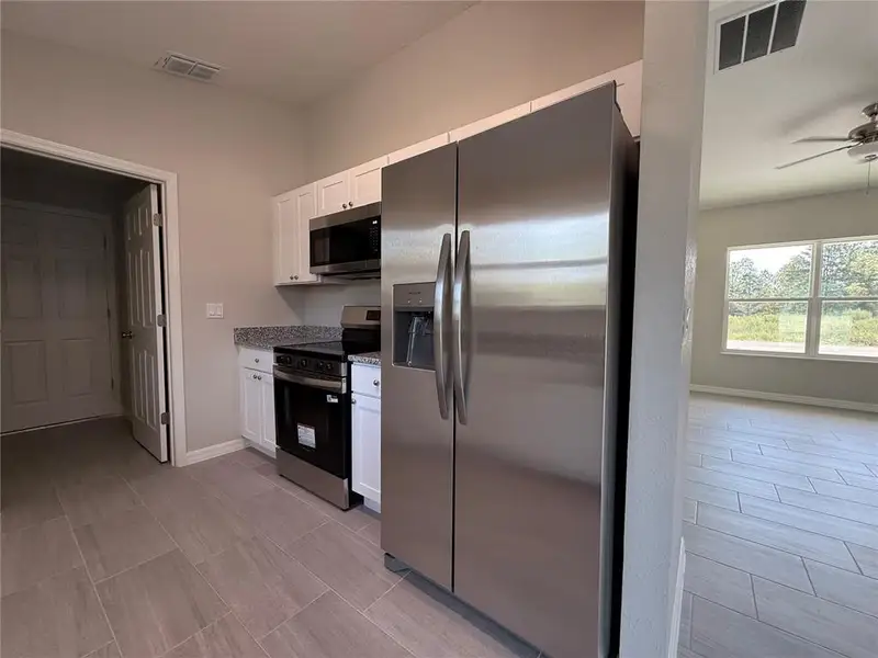 Furnished interior view inside a new home in , Dunnellon (Image 3).