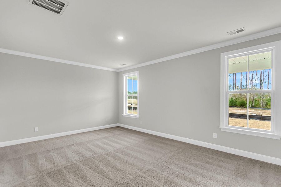 Spacious, unfurnished interior of a new home in Tidewater at Lakes of Cane Bay, Summerville (Image 39).