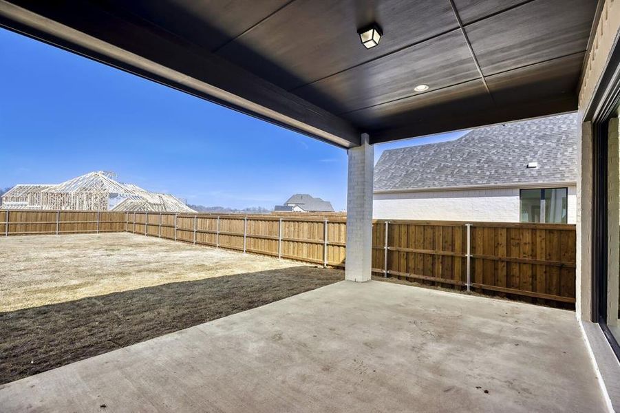 Fenced backyard featuring a patio area