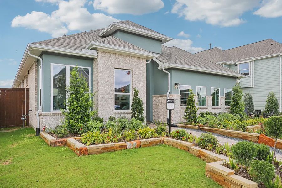 Representative exterior photo of a completed home built from the Lauren by Chesmar Homes in Meridiana 50's, Manvel, TX (Image 2). Representative exterior photo of a completed home built from the Lauren by Chesmar Homes in Meridiana 50's, Manvel, TX (Image 2).