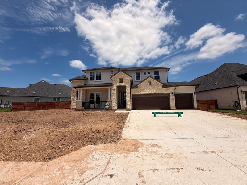 Modern stone and stucco facade welcomes you home with a double garage and spacious front yard. Modern stone and stucco facade welcomes you home with a double garage and spacious front yard.