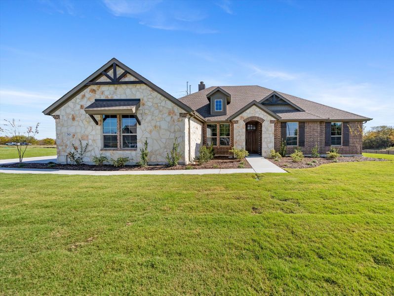Front exterior of a new home in Parker Heights, Valley View, TX, highlighting curb appeal (Image 26). Front exterior of a new home in Parker Heights, Valley View, TX, highlighting curb appeal (Image 26).