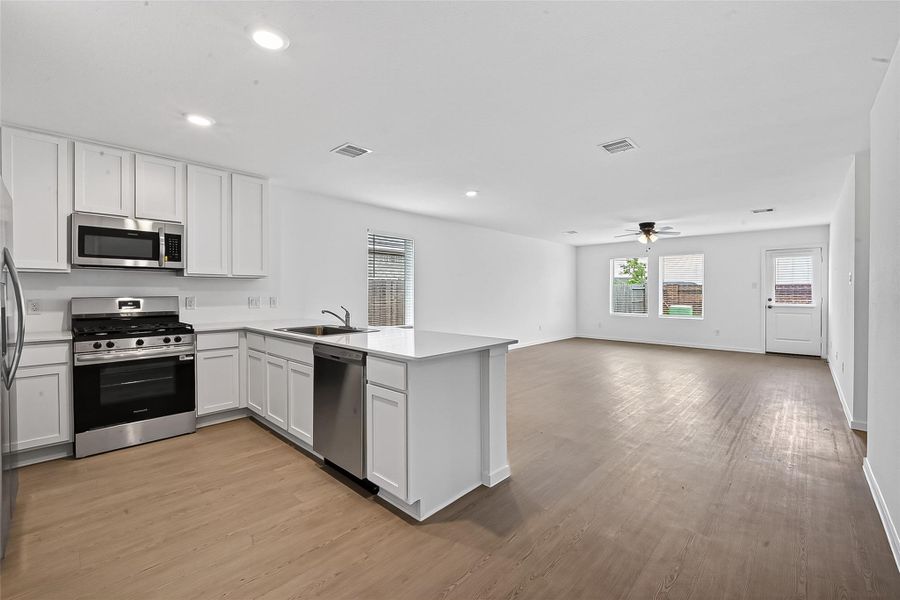 The living room is open directly to the kitchen and makes for great entertaining.