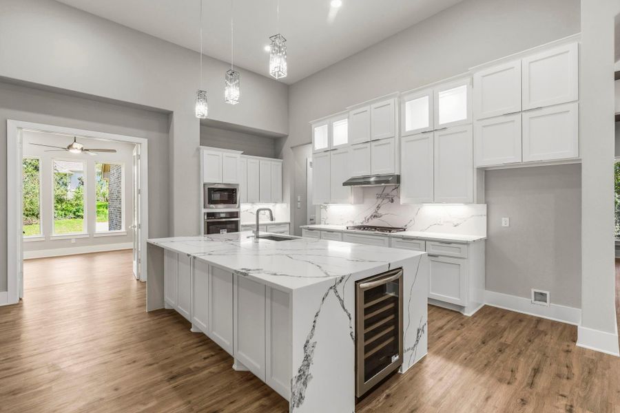 Show off your culinary skills in this lavish kitchen with soft close cabinets. The open design creates an effortless setting for entertaining in style.