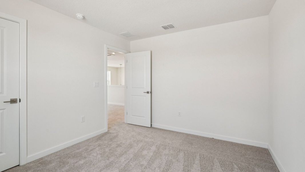 Secondary Bedroom located in the Jupiter in Hamilton Bluff located in Haines City, FL.