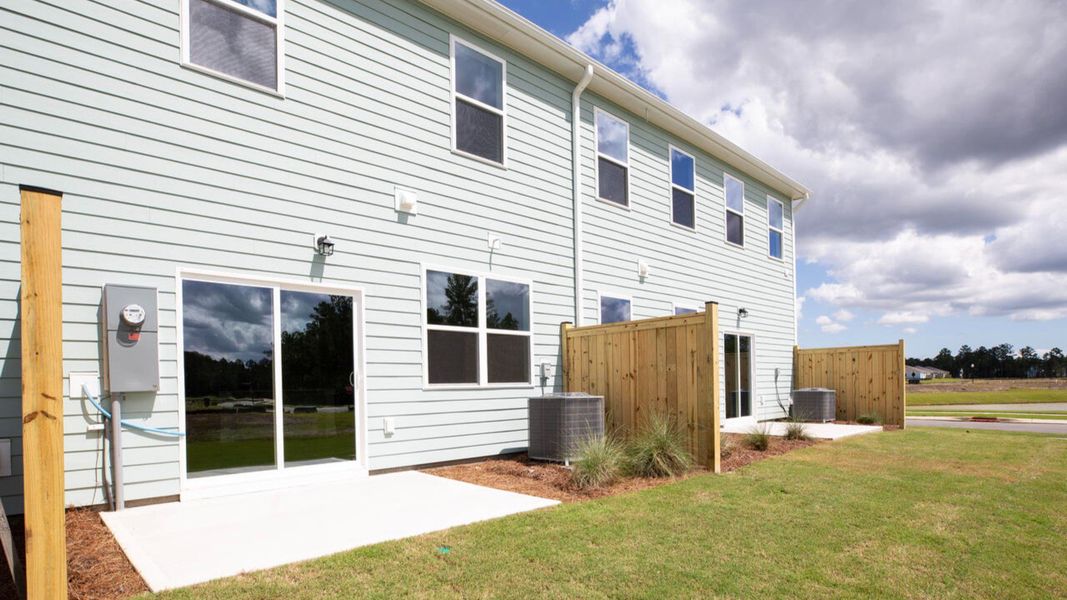 Exterior details and patio area of a home in Indigo Preserve Townhomes, Leland (Image 3).