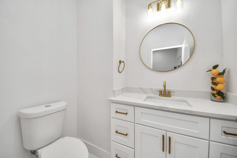 The half-bath located just off the garage for conviniece and privacy. The half-bath located just off the garage for conviniece and privacy.