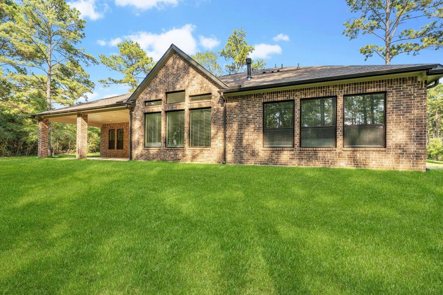 Front exterior of a new home in The Cedars, Plantersville, TX, highlighting curb appeal (Image 2).