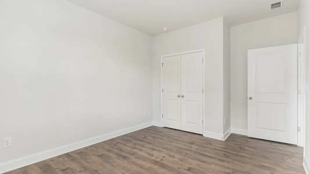 Representative unfurnished interior of a home built from the Covington by D.R. Horton in The Highlands at Cedar Hill Landing, Navassa (Image 36).