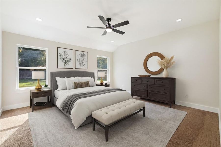 Bedroom with light colored carpet, recessed lighting, ceiling fan, and lofted ceiling