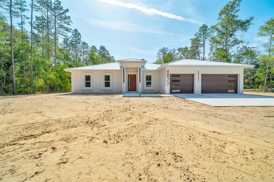 FRONT / HYDRO-SEEDING LAWN AND IRRIGATION SYSTEM IN PLACE