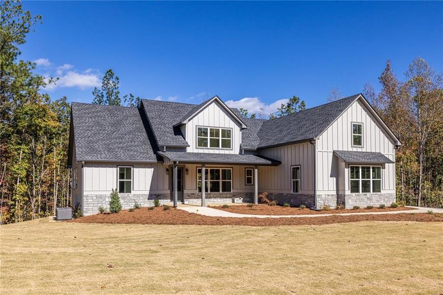 Front exterior of a new home in , Dallas, GA, highlighting curb appeal (Image 1).
