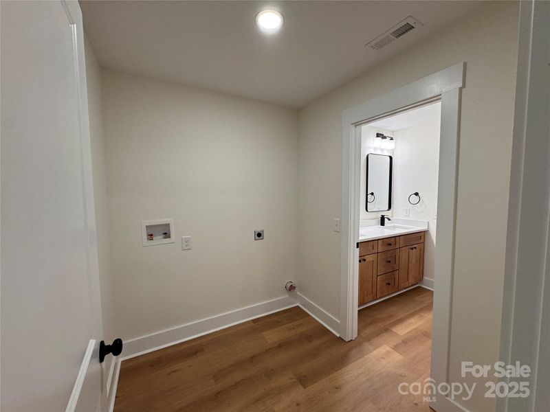 Laundry room just off the primary ensuite.