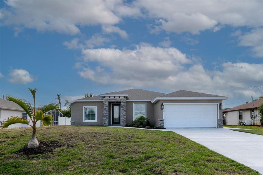 Front exterior of a new home in , Englewood, FL, highlighting curb appeal (Image 22).