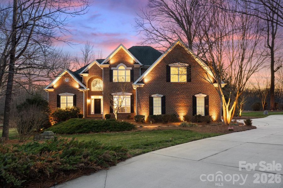 Front exterior of a new home in , Summerfield, NC, highlighting curb appeal (Image 23).