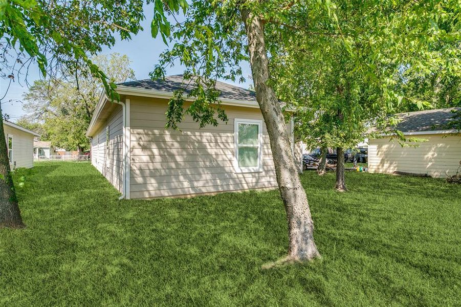 View of home's exterior featuring a lawn View of home's exterior featuring a lawn