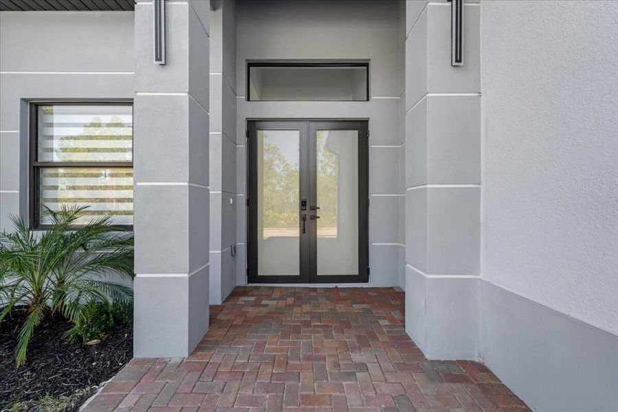 Front exterior of a new home in , Lehigh Acres, FL, highlighting curb appeal (Image 22).