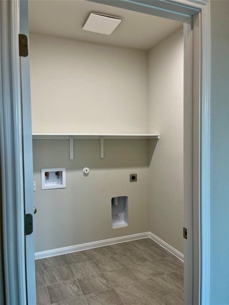 Large utility room with pantry closet