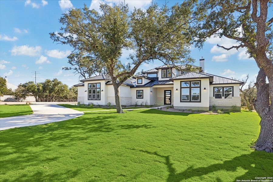 Front exterior of a new home in , Bulverde, TX, highlighting curb appeal (Image 29).