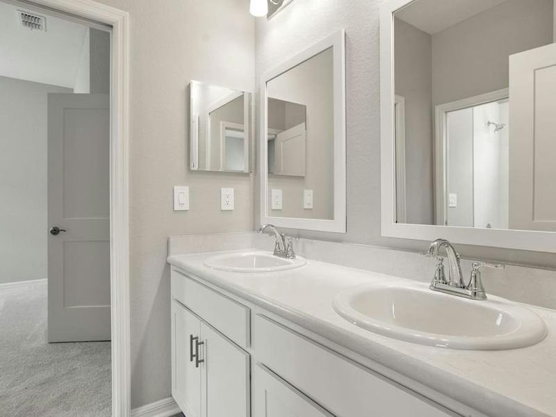 Secondary bedrooms share a Jack-and-Jill hall bath.