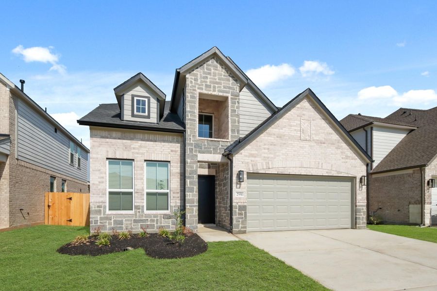 Front exterior of a new home in Barton Creek Ranch, Conroe, TX, highlighting curb appeal (Image 17). Front exterior of a new home in Barton Creek Ranch, Conroe, TX, highlighting curb appeal (Image 17).