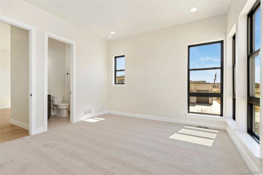 Spacious, unfurnished interior of a new home in Acadia at RainDance, Windsor (Image 9).