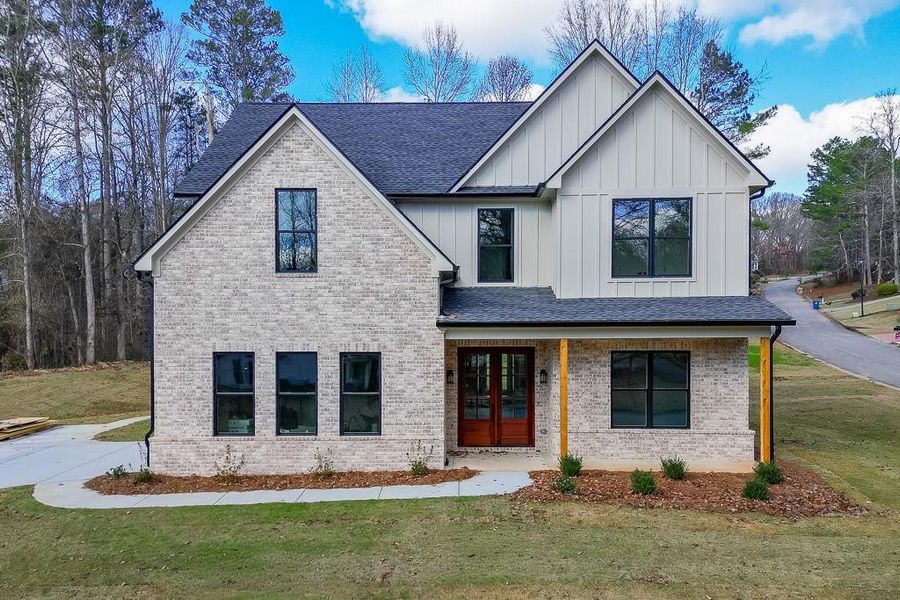 Front exterior of a new home in , Flowery Branch, GA, highlighting curb appeal (Image 27).