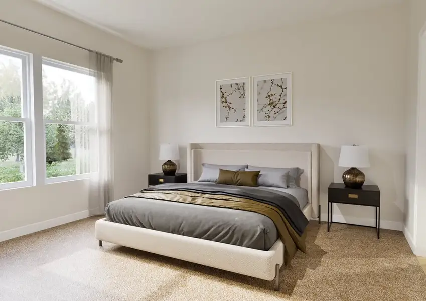 A modern bedroom featuring a beige upholstered bed with gray bedding, flanked by black nightstands with lamps. Two framed artworks hang above the bed, and large windows with sheer curtains allow natural light to fill the room.