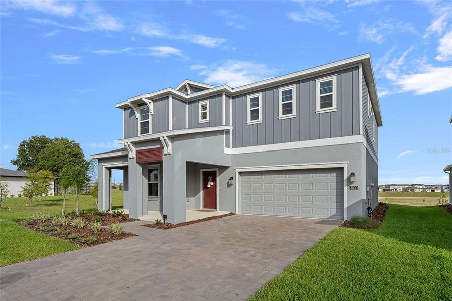 Front exterior of a new home in Wellness Ridge, Clermont, FL, highlighting curb appeal (Image 29).