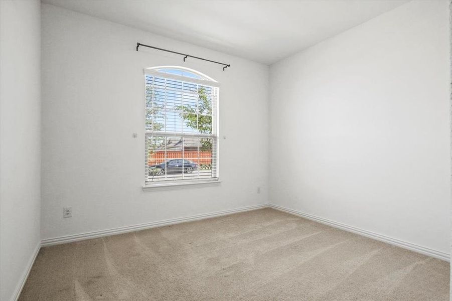 Unfurnished room featuring light carpet and baseboards Unfurnished room featuring light carpet and baseboards