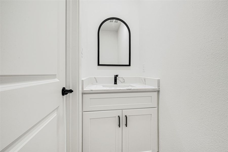 Modern half-bath located on the first floor. Perfect for guests.