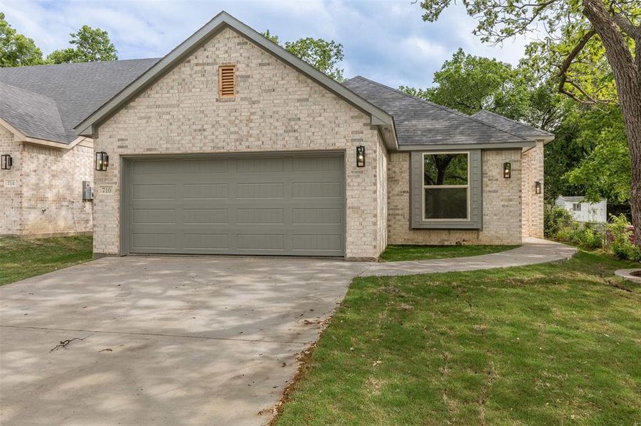 Front exterior of a new home in , Sherman, TX, highlighting curb appeal (Image 20).