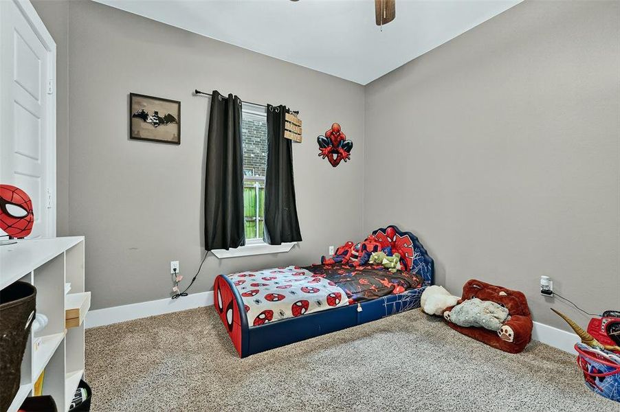 Bedroom with carpet flooring and ceiling fan Bedroom with carpet flooring and ceiling fan