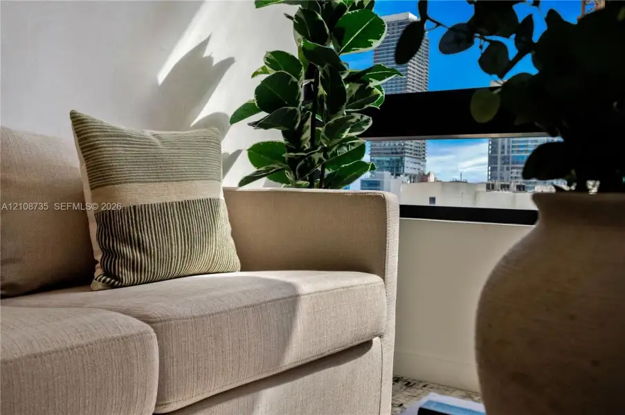 Horizontal window featuring a black frame and urban city skyline backdrop Horizontal window featuring a black frame and urban city skyline backdrop