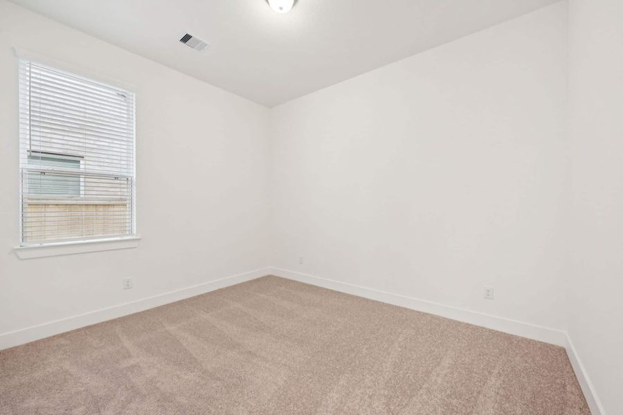 Representative unfurnished interior of a home built from the Lauren by Chesmar Homes in University Heights, Round Rock (Image 17).