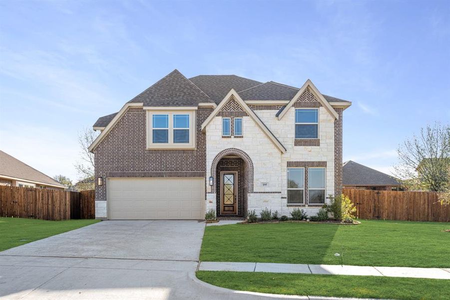 Front exterior of a new home in Sable Creek, Sanger, TX, highlighting curb appeal (Image 2).