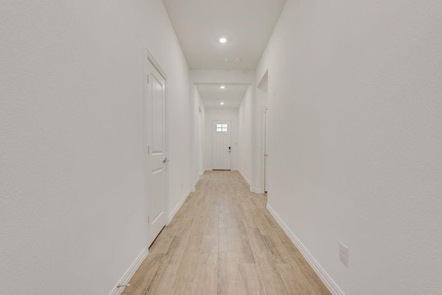 Corridor featuring light hardwood / wood-style flooring