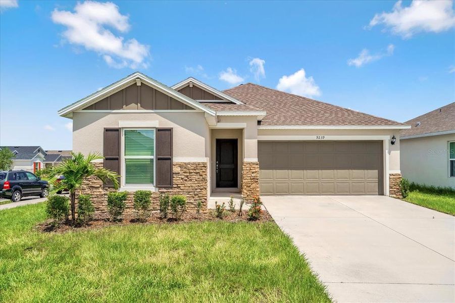 Front exterior of a new home in , Davenport, FL, highlighting curb appeal (Image 2). Front exterior of a new home in , Davenport, FL, highlighting curb appeal (Image 2).
