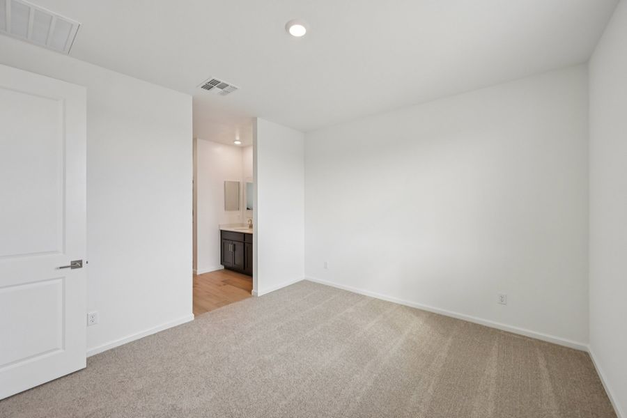 Primary suite. Finishes and options may vary by community