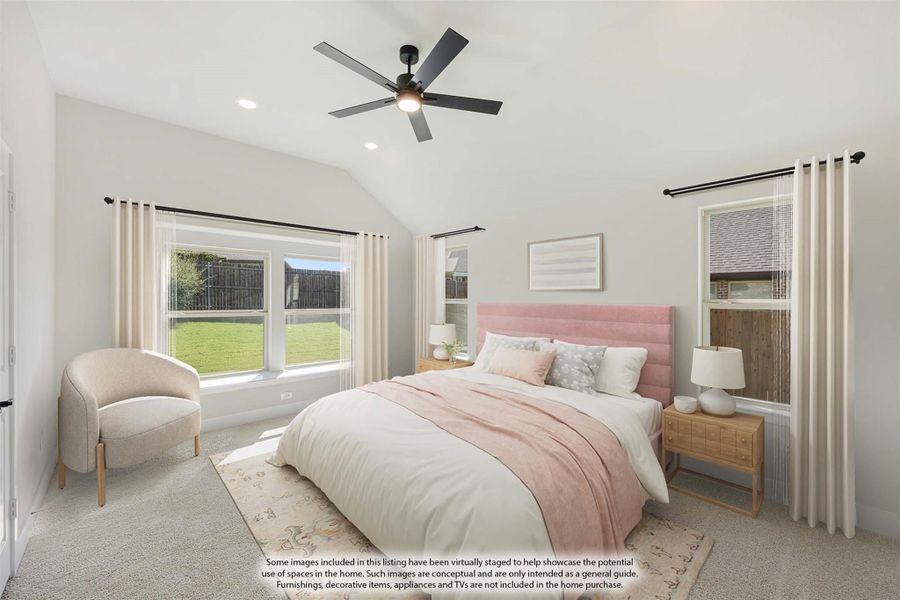 Bedroom with vaulted ceiling, ceiling fan, carpet flooring, and large windows overlooking backyard Bedroom with vaulted ceiling, ceiling fan, carpet flooring, and large windows overlooking backyard