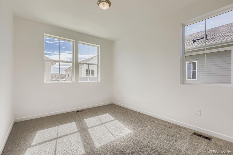 Spacious, unfurnished interior of a new home in Sky Ranch: Parkside Collection, Watkins (Image 10).