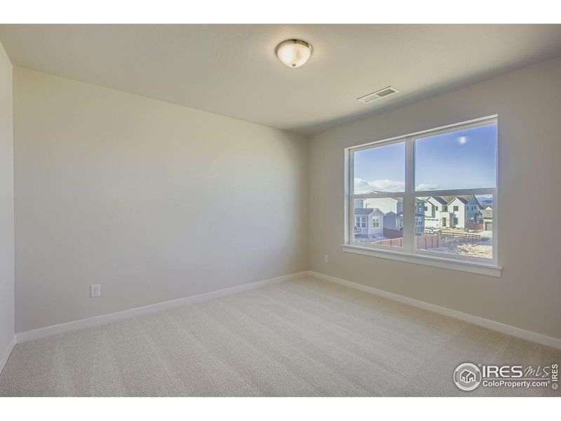 Spacious, unfurnished interior of a new home in RainDance National 60/70, Windsor (Image 21).