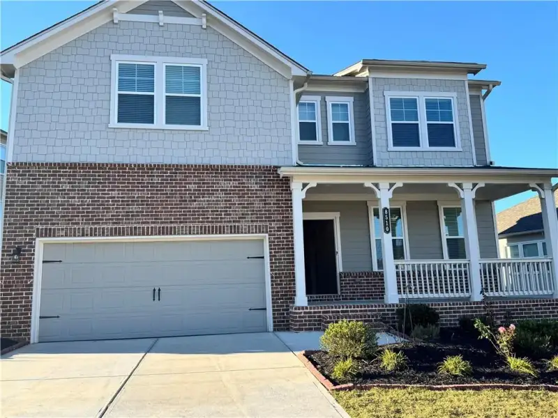 Front exterior of a new home in Stratford Hills, Ball Ground, GA, highlighting curb appeal (Image 1). Front exterior of a new home in Stratford Hills, Ball Ground, GA, highlighting curb appeal (Image 1).