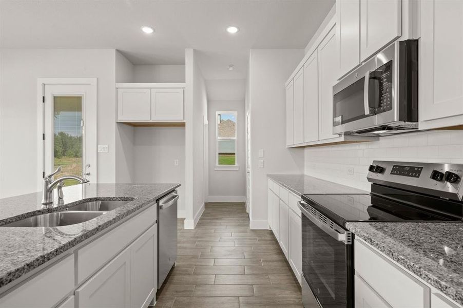 Furnished interior view inside a new home in Saddleback Estates, Boyd (Image 11).