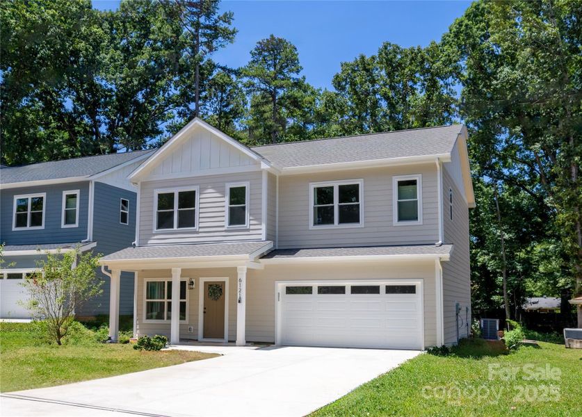 Front exterior of a new home in , Charlotte, NC, highlighting curb appeal (Image 20).