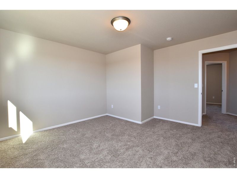 Spacious, unfurnished interior of a new home in Union Colony West, Greeley (Image 35).