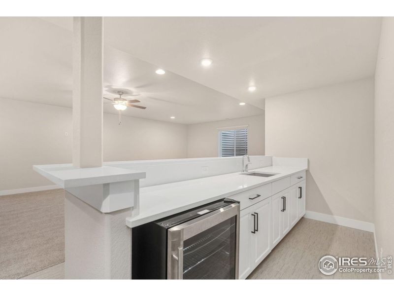 White Sand Quartz Countertops and beverage refrigerator!