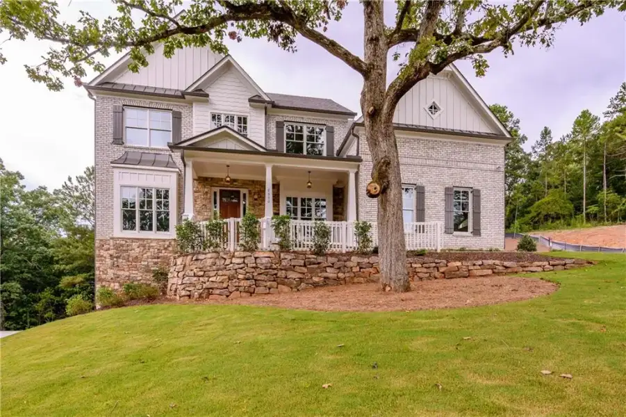 Front exterior of a new home in , Cumming, GA, highlighting curb appeal (Image 2). Front exterior of a new home in , Cumming, GA, highlighting curb appeal (Image 2).
