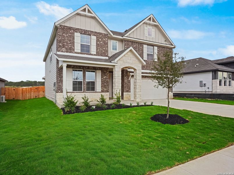 Front exterior of a new home in Saddle Creek Ranch, Cibolo, TX, highlighting curb appeal (Image 2).