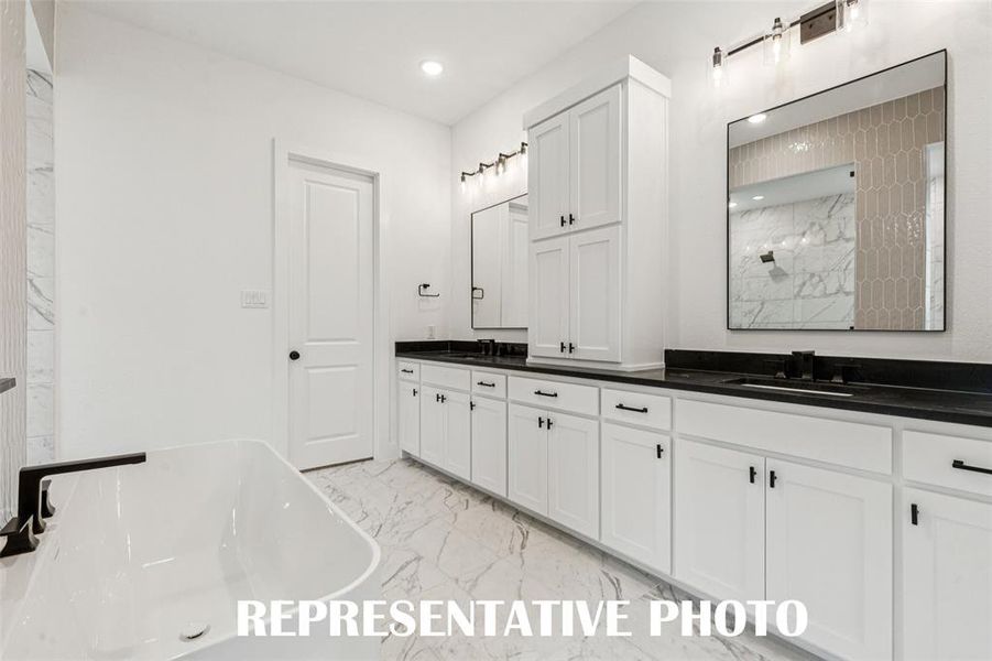 With his and her vanities, there is plenty of room for 2 in this lovely owner's bath.  REPRESENTATIVE PHOTO.